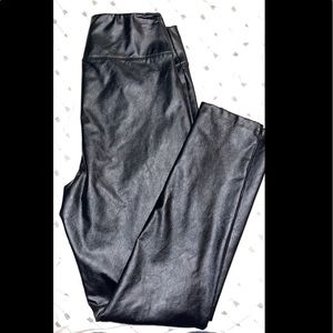 Leather leggings size small. Fit more like a large and stretch in the waist.